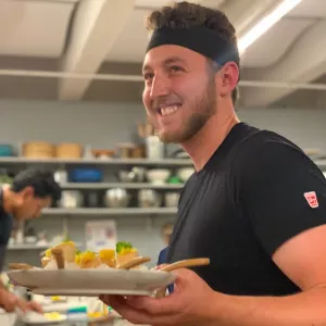Brandon Kaufman serving food