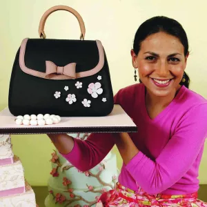 cake decorator elisa strauss with a handbag cake she made