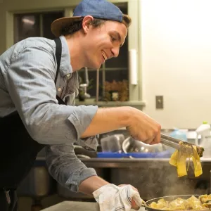 chef evan hanczor preparing pasta
