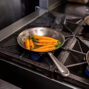cooking carrots on a gas range