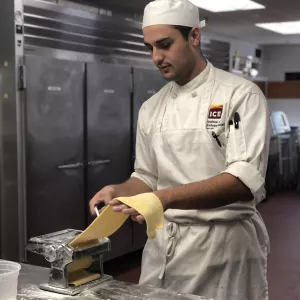 Nick Huddleston makes pasta at ICE Los Angeles.
