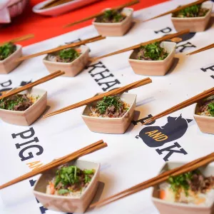 pig & khao serves tasting portions of a dish with chopsticks at an event at the Institute of Culinary Education