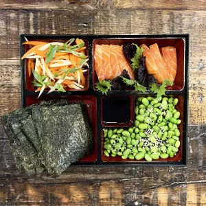 A bento snacking box with sashimi.