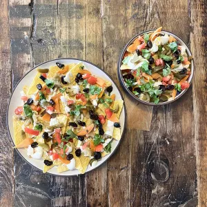 Nachos topped with fermented vegetables and cashew cream