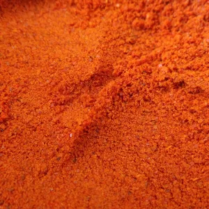 A close up of red paprika powder