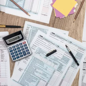 personal finance paperwork and calculator