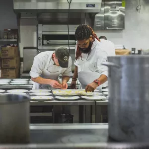 Chefs working on the line at a restaurant.