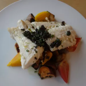 Black sea bass is served with Kalamata olive vinaigrette.