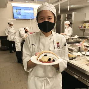 Stephanie Loo presents a plated dessert