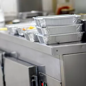 Takeout containers in a restaurant kitchen