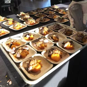 A tray of samples at a food festival.