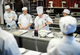 Plant-Based Culinary Arts students work in a classroom