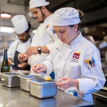 Two students and instructor at work