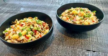 Two bowls of fried rice.