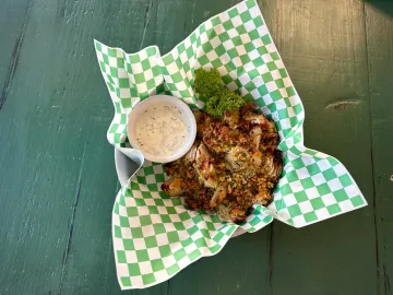 Fermented blooming onion served with ranch dressing.