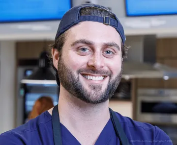 Dr. Nate Wood, a man with dark hair, blue eyes and a backwards