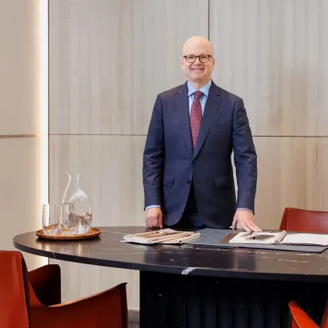Michael Lawrence stands behind desk