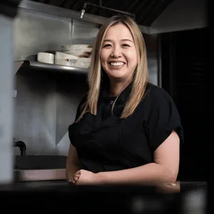 Chef Helen Nyugen at a professional photo shoot in a demo kitchen. 