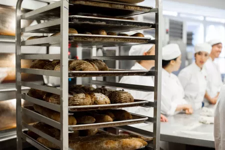 Breads rest on a rack after baking at the Institute of Culinary Education