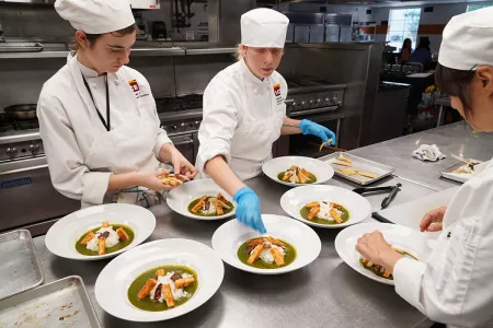 ICE Los Angeles plant based culinary program students in teaching kitchens