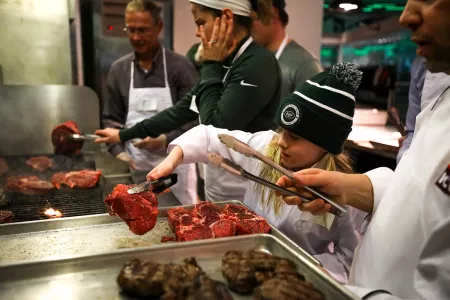 Meat grilling at a Jets event.