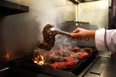 A steak pulled off the grill at a Jets event.