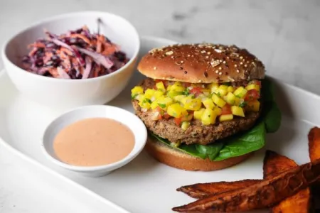 a burger with mango salsa and red cabbage from ICE's Culinary Nutrition curriculum