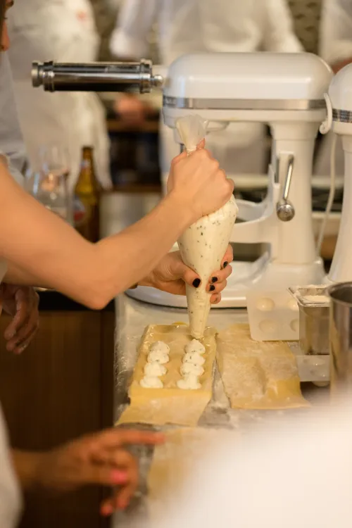 A guest fills pasta