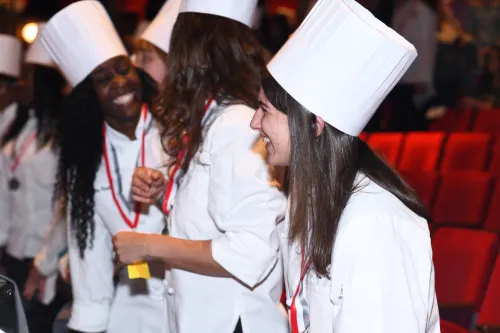 Students smiling at graduation.