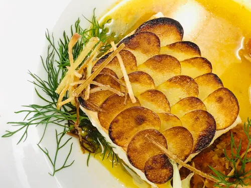 A composed, plated fish dish made as part of ICE's culinary career training program
