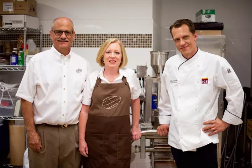 John and Kim Vessa, owners of Cacao Cucina, stand with Chef Michael Laiskonis, ICE Creative Director, in the ICE Chocolate Lab