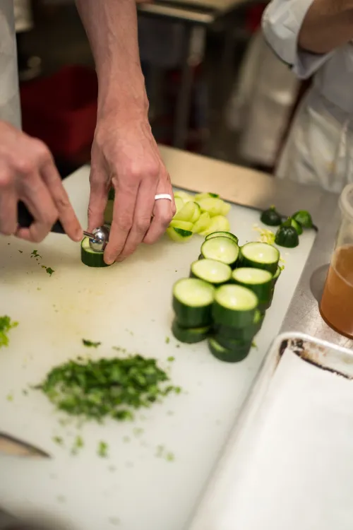 A recreational student practices knife skills