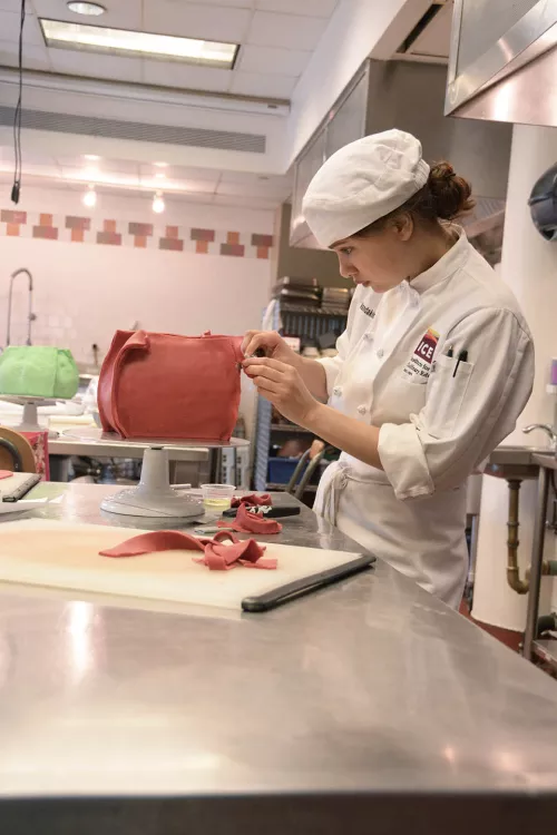 A student works with fondant in the ICE Professional Cake Decorating program
