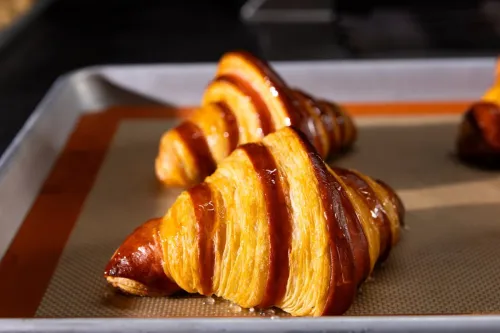 close up of a two-tone freshly baked croissant
