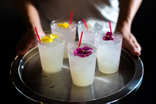 Cocktails garnished with flowers at ICE