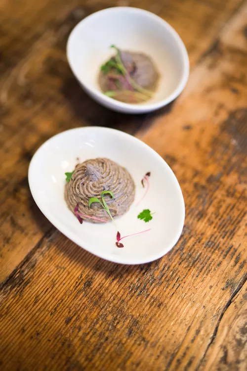 Truffled portobello mousse is plated with fig-thyme preserve