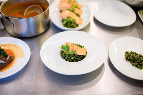 A salmon dish is plated.