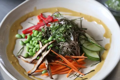 a composed dish of fresh vegetables and soba noodles from ICE's Culinary Nutrition curriculum