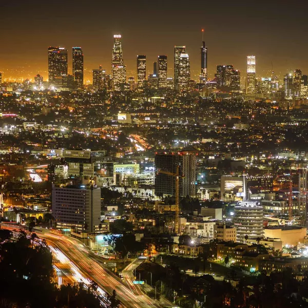 A photo of the busy city lights of downtown Los Angeles at night