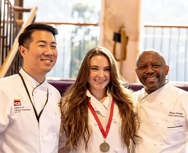 LA alumni with chef instructor at commencement