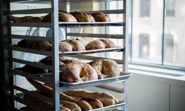 Freshly baked bread cools on speed racks 