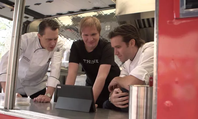 Michael Laiskonis, Florian Pinel and James Briscione inside the IBM Food Truck
