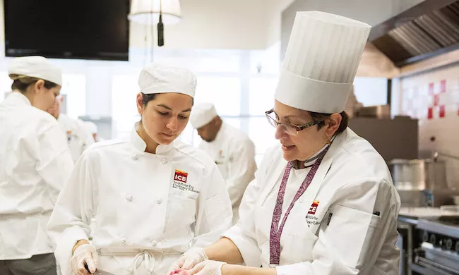 ICE culinary program instructor with student