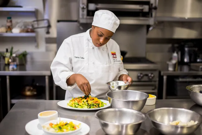 Student plating a health-centered meal