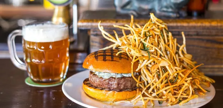 burger and fries at the spotted pig in new york photo courtesy of eater