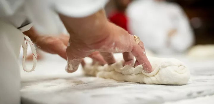 pastry students kneading dough for bread