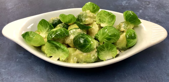 A dish of Brussels sprouts is served.