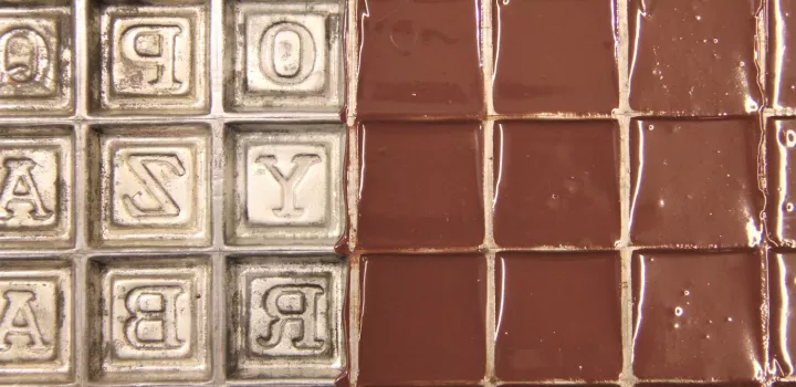 casting chocolate in an alphabet block mold
