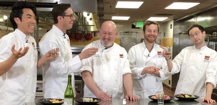 Chef Frank Proto toasts to sushi making with the Try Guys.