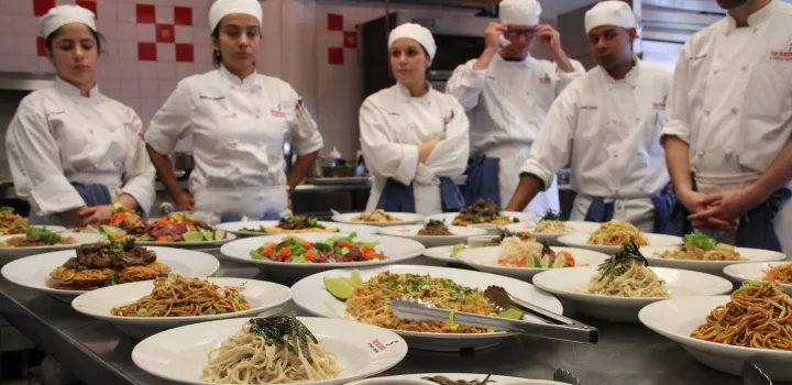 culinary students making a meal from around the world